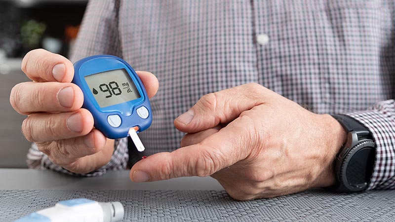 man testing glucose