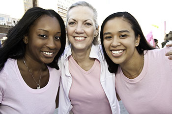 Three women smiling together